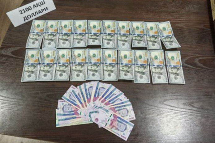 “Biznesni rivojlantirish banki” xodimi 2,1 ming dollar bilan qo'lga tushdi